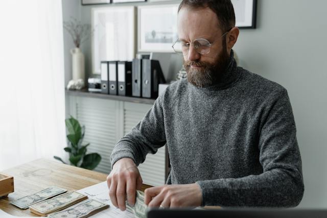 property manager counting money and balancing budgets